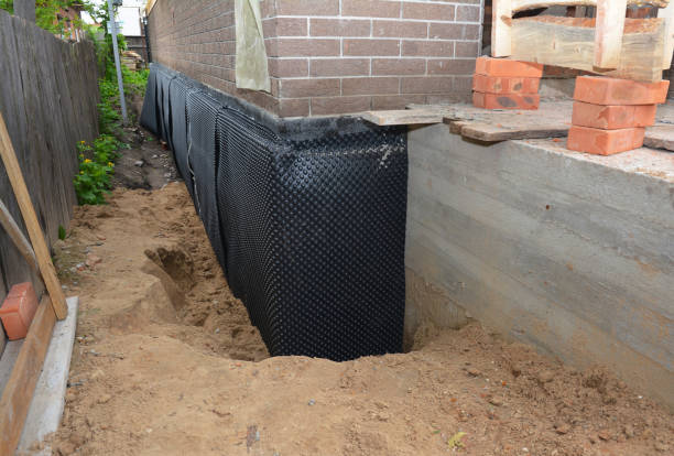 Happy homeowners after waterproofing job in Chalmers